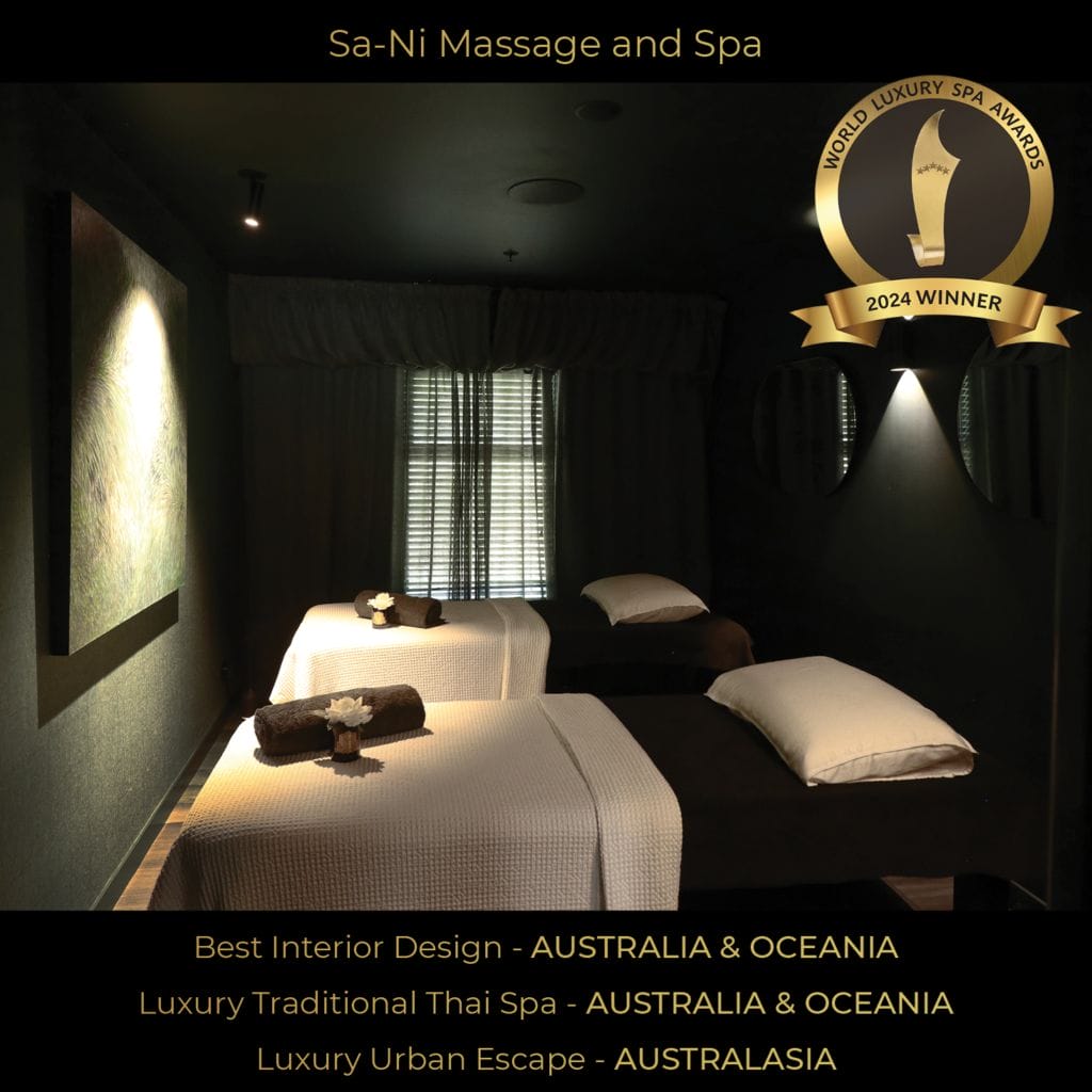 Award-winning Sa-Ni Massage and Spa treatment room with two massage beds, soft lighting, and tranquil decor.